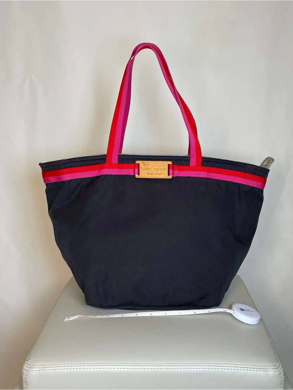 kate spade black tote with pink and red trim